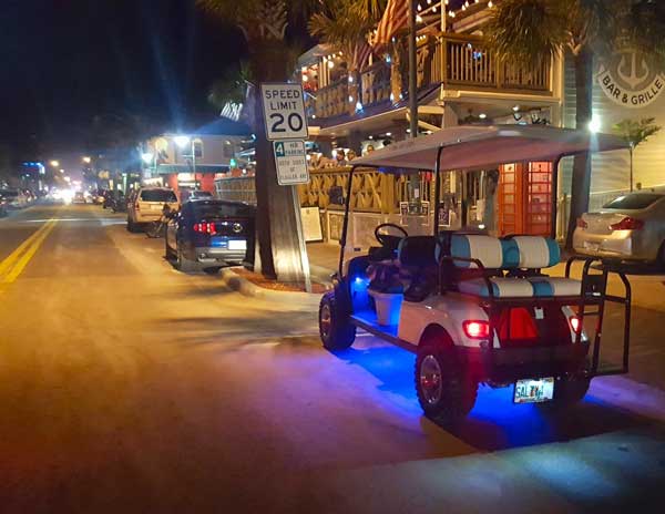 Salty Rentals Golf Cart at night on Flagler Ave.